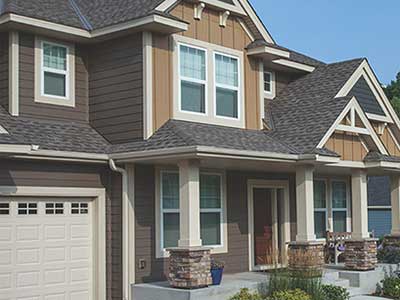 Front of home with light and dark brown LP siding